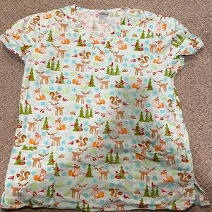 XL women’s winter theme scrub shirt.